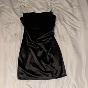 Black satin cow neck mini dress with rhinestone straps